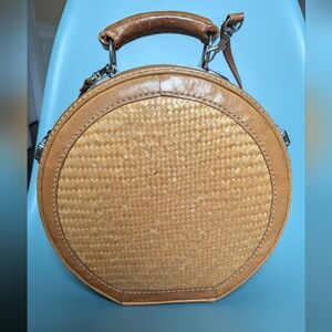 Bamboo handbag with strap.